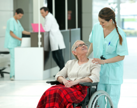 nurse looking at elderly and smiling